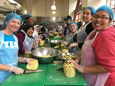 Volunteers prep food at Project Open Hand in San Francisco, an organization that provides nutritious meals to individuals who are sick and vulnerable. Spring 2018